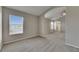 Spacious main bedroom featuring neutral paint, carpet, and a large window with natural light at 1806 Mira Lago Cir, Ruskin, FL 33570