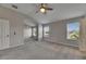 Large main bedroom featuring vaulted ceilings, ceiling fan, neutral walls and carpet at 1806 Mira Lago Cir, Ruskin, FL 33570