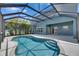 The private screened-in pool is steps away from the home and is the perfect place to spend a warm day at 1806 Mira Lago Cir, Ruskin, FL 33570
