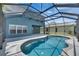 Inviting in-ground pool within a screened lanai, perfect for enjoying outdoor living and relaxation at 1806 Mira Lago Cir, Ruskin, FL 33570