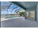 Enclosed pool area boasts an outdoor pool with a beautiful lake view at 1806 Mira Lago Cir, Ruskin, FL 33570