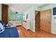 Bedroom featuring a trundle bed, dresser, and coastal decor at 18102 2Nd St E, Redington Shores, FL 33708
