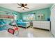 Cozy bedroom featuring bunk beds, a single bed, and a dresser at 18102 2Nd St E, Redington Shores, FL 33708