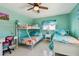 Cozy bedroom featuring bunk beds, a single bed, and a desk at 18102 2Nd St E, Redington Shores, FL 33708