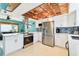 Modern kitchen featuring stainless steel appliances and abundant counter space at 18102 2Nd St E, Redington Shores, FL 33708