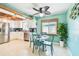 Beautifully designed kitchen featuring stainless steel appliances and a charming dining area at 18102 2Nd St E, Redington Shores, FL 33708