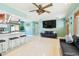 Bright and airy living room showcasing a comfortable seating arrangement and open floor plan at 18102 2Nd St E, Redington Shores, FL 33708
