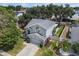 Aerial view of a blue two-story home with a well-maintained yard and a gray roof at 1830 Citrus Orchard Way, Valrico, FL 33594