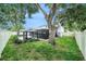 Large backyard featuring a screened patio, gazebo, and mature trees for shade at 1830 Citrus Orchard Way, Valrico, FL 33594