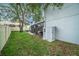 Side yard features a screened-in porch, small shed, and large mature tree at 1830 Citrus Orchard Way, Valrico, FL 33594