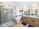 Elegant bathroom with a soaking tub, glass shower, and dual vanity at 1830 Citrus Orchard Way, Valrico, FL 33594