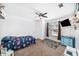 Playful bedroom featuring a bright bed, ceiling fan, and window at 1830 Citrus Orchard Way, Valrico, FL 33594