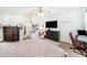 Comfortable bedroom featuring a large bed, ceiling fan, and closet at 1830 Citrus Orchard Way, Valrico, FL 33594