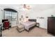Serene bedroom with neutral tones, a ceiling fan, and a window at 1830 Citrus Orchard Way, Valrico, FL 33594