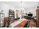 Open floor plan showcasing the dining room, with hardwood floors, connecting to the living room at 1830 Citrus Orchard Way, Valrico, FL 33594