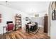 Dining area featuring a hardwood floor, a large table, and ample seating for six at 1830 Citrus Orchard Way, Valrico, FL 33594