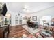 Cozy living room featuring stylish furniture, wood floors, and natural light at 1830 Citrus Orchard Way, Valrico, FL 33594