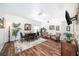 Inviting living room with wood floors, dining area, and comfortable seating at 1830 Citrus Orchard Way, Valrico, FL 33594