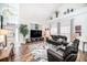Spacious living room with soaring ceilings, hardwood floors, and modern décor at 1830 Citrus Orchard Way, Valrico, FL 33594