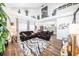 Bright living room featuring high ceilings, wood floors, and comfortable leather seating at 1830 Citrus Orchard Way, Valrico, FL 33594