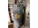 Close up of A.O. Smith Signature 100 water heater with energy guide and plumbing at 1830 Citrus Orchard Way, Valrico, FL 33594