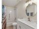 Clean bathroom features a shower and tub combination and a modern vanity at 1909 E View Dr, Sun City Center, FL 33573
