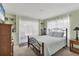 Cozy bedroom with built-in shelving, a ceiling fan, and plenty of natural light at 1909 E View Dr, Sun City Center, FL 33573