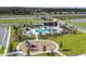 Aerial of community featuring pool, lounge areas and playground at 19153 Elsimont Isle, Lutz, FL 33558