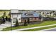 Community clubhouse with modern design and lush landscaping at 19153 Elsimont Isle, Lutz, FL 33558