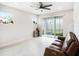 Bright living room featuring a sliding glass door to the backyard and modern finishes at 19153 Elsimont Isle, Lutz, FL 33558
