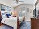 Comfortable bedroom featuring arched window with shutters and light color walls at 19337 Weymouth Dr, Land O Lakes, FL 34638