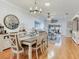 The dining room features hardwood floors and a view to the living room at 19337 Weymouth Dr, Land O Lakes, FL 34638