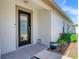 Home featuring a decorative front door, plants, and manicured landscaping at 19337 Weymouth Dr, Land O Lakes, FL 34638