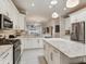 Spacious kitchen with large island, stainless appliances and open to the dining and living areas at 19337 Weymouth Dr, Land O Lakes, FL 34638