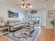 Living room features hardwood floors and sliding door access to outdoor patio at 19337 Weymouth Dr, Land O Lakes, FL 34638