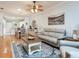 Open concept living room flows into the dining room and features hardwood floors at 19337 Weymouth Dr, Land O Lakes, FL 34638