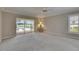 Bright bedroom with sliding glass doors opening to the pool and golf course views at 2017 S Pebble Beach Blvd, Sun City Center, FL 33573