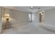 Spacious carpeted bedroom featuring a ceiling fan, crown molding, and natural light from plantation shutters at 2017 S Pebble Beach Blvd, Sun City Center, FL 33573