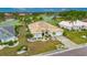Charming single-story home featuring a tile roof and lush landscaping near a golf course at 2017 S Pebble Beach Blvd, Sun City Center, FL 33573