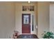 Close-up of a front door with decorative glass and sidelight at 2017 S Pebble Beach Blvd, Sun City Center, FL 33573