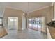 Open kitchen with tile floors, granite countertops and built-in cabinets with a view to the pool at 2017 S Pebble Beach Blvd, Sun City Center, FL 33573