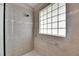 Spacious shower with glass block window and handicap bar at 2017 S Pebble Beach Blvd, Sun City Center, FL 33573