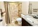 Tiled bathroom featuring granite counters, updated fixtures, and a tiled walk-in shower at 21422 Draycott Way, Land O Lakes, FL 34637