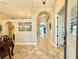 Bright foyer with decorative arches and tiled floors leading into the home at 21422 Draycott Way, Land O Lakes, FL 34637