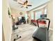 Spacious home gym with treadmill, rowing machine, and media center at 21422 Draycott Way, Land O Lakes, FL 34637