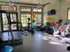 Bright fitness center with gym equipment, exercise balls, and large windows at 21422 Draycott Way, Land O Lakes, FL 34637