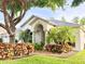 Charming single-story home with manicured lawn and vibrant landscaping at 21422 Draycott Way, Land O Lakes, FL 34637