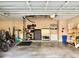 Spacious garage with lots of storage including tool chests, cabinets, and shelves at 21422 Draycott Way, Land O Lakes, FL 34637