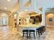 Open kitchen featuring granite countertops, an island with barstool seating, and stainless steel appliances at 21422 Draycott Way, Land O Lakes, FL 34637