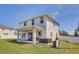 Home's backyard featuring a hot tub and covered patio area at 2190 Fairway S Ave, St Petersburg, FL 33712